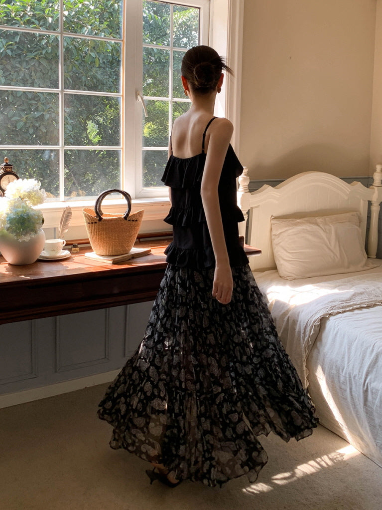 Black ruffled camisole and patterned maxi skirt