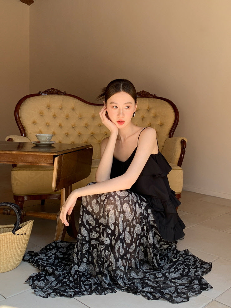 Black ruffled camisole and patterned maxi skirt